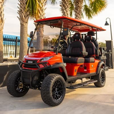 Six-seater luxury golf cart from the Adventures Beach Rentals fleet — a registered street-legal LSV